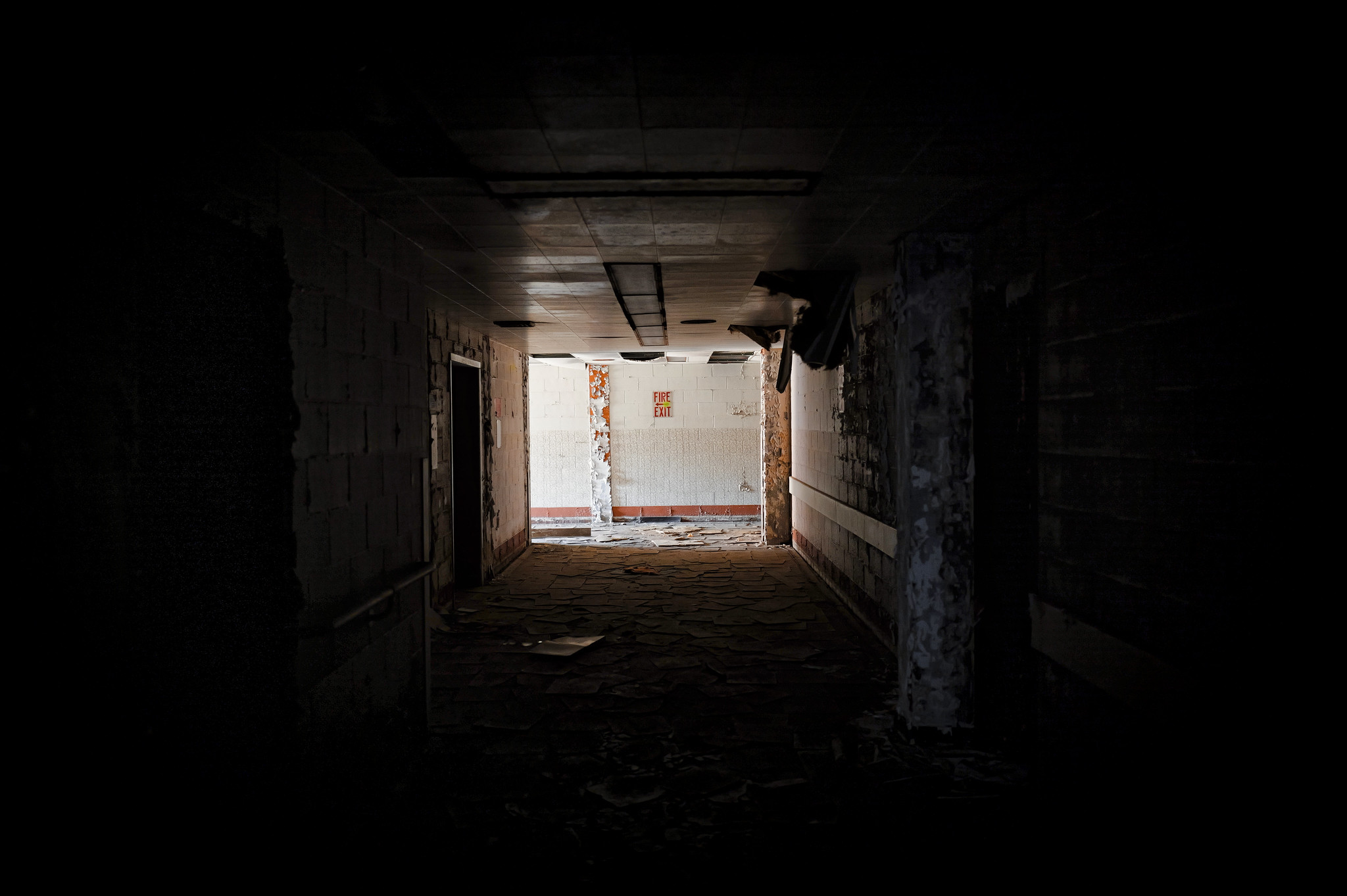 A Hallway Marked With Exit Signs
